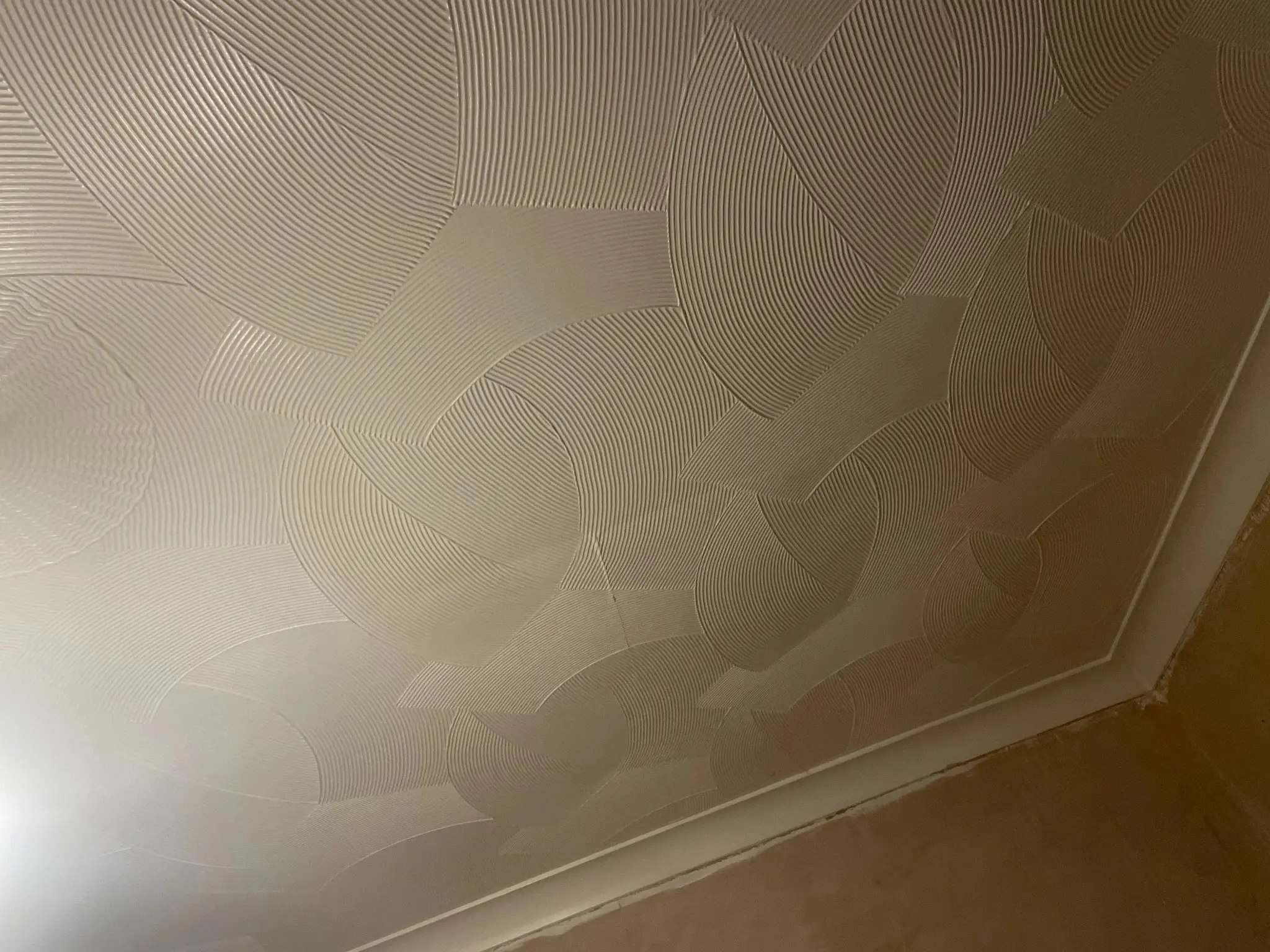 Textured Artex ceiling in a London property before asbestos assessment or removal