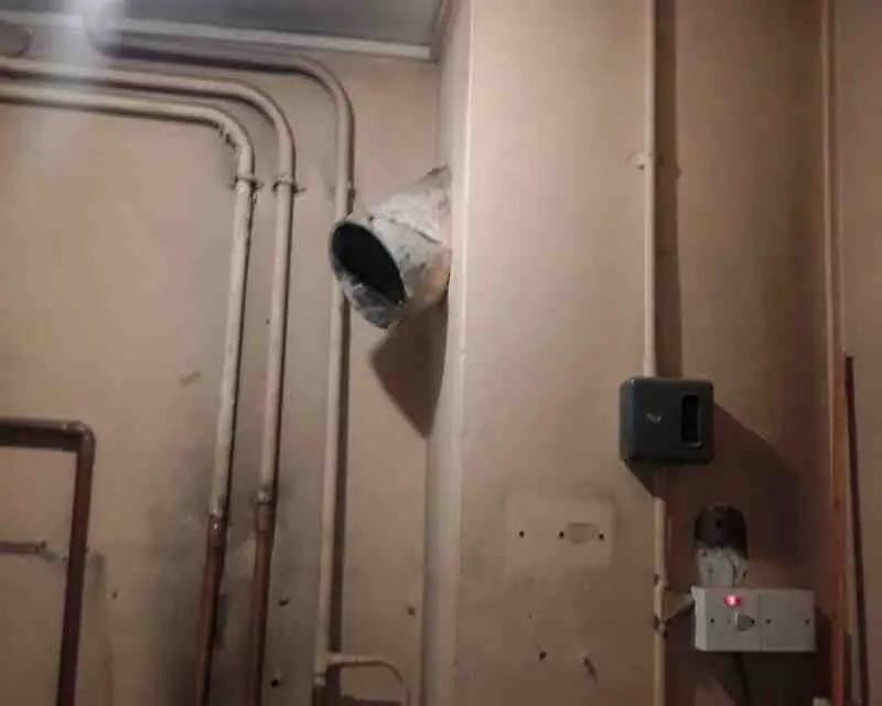 Asbestos cement flue removal London — asbestos cement flue or pipe identified during an asbestos survey