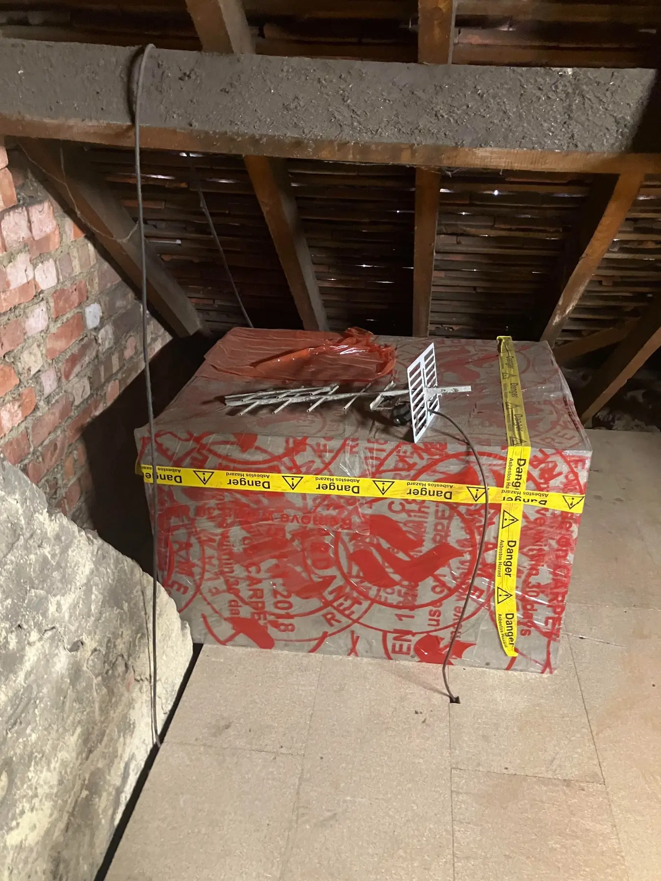 Asbestos cement water tank in a London loft