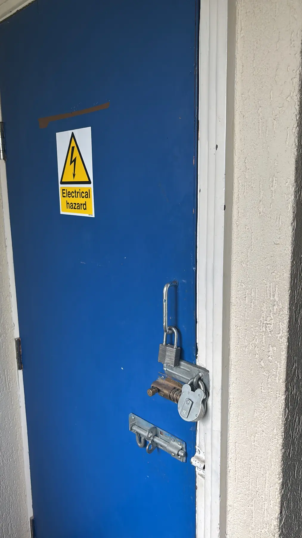 Electrical cupboard and surrounding panels reviewed before asbestos removal